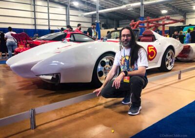 San Antonio Photographer and Graphic Designer Delton M. Childs III next to Mach 1 from Speed Racer.